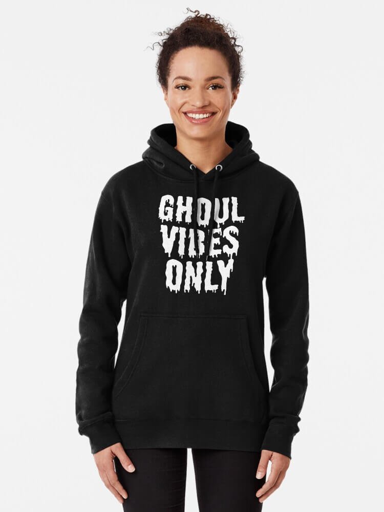 Person wearing a black ‘Ghoul Vibes Only’ hoodie with white dripping gothic lettering